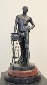 Gaius Mucius Scaevola by Kumm, bronze sculpture on red granite